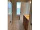 Bathroom with vanity, shower/tub combo and tiled floor at 4513 Saxon Dr, New Smyrna Beach, FL 32169