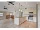 Modern kitchen with white cabinets and granite island at 6468 Engram Rd, New Smyrna Beach, FL 32169