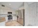 Modern kitchen with stainless steel appliances and granite countertops at 6468 Engram Rd, New Smyrna Beach, FL 32169