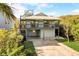 Two-story house with light blue siding, a large deck, and a spacious driveway at 6468 Engram Rd, New Smyrna Beach, FL 32169