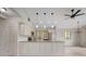 White kitchen with granite countertops and stainless steel appliances at 6468 Engram Rd, New Smyrna Beach, FL 32169