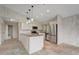 Updated kitchen with granite countertops, white cabinets, and stainless steel appliances at 6468 Engram Rd, New Smyrna Beach, FL 32169