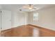 Well-lit bedroom with hardwood floors and built-in closet at 6468 Engram Rd, New Smyrna Beach, FL 32169
