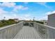 Elevated deck with railing and neighborhood view at 6468 Engram Rd, New Smyrna Beach, FL 32169