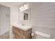 Clean bathroom with modern vanity and shiplap walls at 6468 Engram Rd, New Smyrna Beach, FL 32169