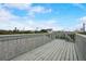 Elevated deck with railing and neighborhood view at 6468 Engram Rd, New Smyrna Beach, FL 32169