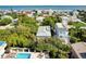 Coastal home with pool, surrounded by lush greenery, seen from above at 6468 Engram Rd, New Smyrna Beach, FL 32169
