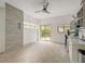 Multi-purpose room with tile floors, sliding glass doors, and a built-in kitchenette at 6468 Engram Rd, New Smyrna Beach, FL 32169