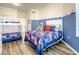 Bedroom with a double bed and a bunk bed, decorated in a nautical theme at 5300 S Atlantic Ave # 6-505, New Smyrna Beach, FL 32169