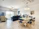 Bright living room with ocean view, dining area, and comfortable seating at 5300 S Atlantic Ave # 6-505, New Smyrna Beach, FL 32169