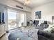 Living room with ocean view, comfy seating, and access to balcony at 5300 S Atlantic Ave # 6-505, New Smyrna Beach, FL 32169