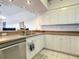 Clean kitchen with stainless steel appliances and white cabinets at 5300 S Atlantic Ave # 6-505, New Smyrna Beach, FL 32169