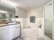Bathroom with a soaking tub, shower, and double vanity at 5300 S Atlantic Ave # 6-505, New Smyrna Beach, FL 32169