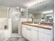 Bathroom with a walk-in shower and double vanity at 5300 S Atlantic Ave # 6-505, New Smyrna Beach, FL 32169