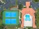 Aerial view of tennis courts and pool area at 5300 S Atlantic Ave # 8502, New Smyrna Beach, FL 32169