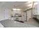 Modern kitchen with white cabinets, granite countertops, and stainless steel appliances at 5300 S Atlantic Ave # 8502, New Smyrna Beach, FL 32169