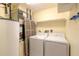 Laundry room with washer, dryer, and ample storage shelving at 5300 S Atlantic Ave # 8502, New Smyrna Beach, FL 32169