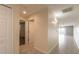 Clean hallway with tile floors and doors to bedrooms and living areas at 5300 S Atlantic Ave # 8502, New Smyrna Beach, FL 32169