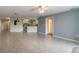 Spacious living area with tile floors and kitchen access at 5300 S Atlantic Ave # 8502, New Smyrna Beach, FL 32169