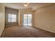 Spacious bedroom featuring a sliding glass door to a balcony at 5300 S Atlantic Ave # 8502, New Smyrna Beach, FL 32169