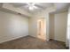 Bright bedroom with carpeted floors and access to a bathroom at 5300 S Atlantic Ave # 8502, New Smyrna Beach, FL 32169
