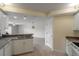 Open kitchen with white cabinets, granite countertops and a breakfast bar at 5300 S Atlantic Ave # 8502, New Smyrna Beach, FL 32169