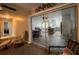 View of living room and kitchen through glass doors at 806 E 2Nd Ave, New Smyrna Beach, FL 32169