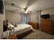 Bedroom with double bed, dresser, and ceiling fan at 806 E 2Nd Ave, New Smyrna Beach, FL 32169