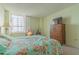 Bedroom with ocean view and floral bedding at 2987 S Atlantic # 1602, Daytona Beach Shores, FL 32118