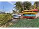 Outdoor kayak storage racks with various kayaks at 135 Marina Bay Dr # 135, New Smyrna Beach, FL 32169