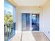 Covered balcony with sliding glass doors and view of the building at 5300 S Atlantic Ave # 9201, New Smyrna Beach, FL 32169