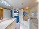 Main bathroom with granite vanity, tub and shower at 5300 S Atlantic Ave # 9201, New Smyrna Beach, FL 32169