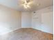 Bright bedroom with carpeted floor, ceiling fan, and a door to hallway at 5300 S Atlantic Ave # 9201, New Smyrna Beach, FL 32169