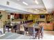 Community clubhouse with kitchen, seating, and TV area at 5300 S Atlantic Ave # 9201, New Smyrna Beach, FL 32169