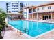 Community pool with lounge chairs and covered seating area at 5300 S Atlantic Ave # 9201, New Smyrna Beach, FL 32169