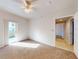 Bright bedroom with carpet flooring and access to another room at 5300 S Atlantic Ave # 9201, New Smyrna Beach, FL 32169