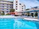 Resort-style pool with plenty of lounge chairs at 5300 S Atlantic Ave # 9201, New Smyrna Beach, FL 32169