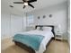 Bedroom with queen bed, ceiling fan, and ample closet space at 610 S Atlantic Ave, New Smyrna Beach, FL 32169