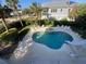 Aerial view showcasing a kidney-shaped pool, hot tub, and surrounding patio furniture at 610 S Atlantic Ave, New Smyrna Beach, FL 32169