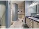 Bathroom with double vanity and soaking tub at 610 S Atlantic Ave, New Smyrna Beach, FL 32169