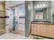 Clean bathroom with a shower/tub combo and wood vanity at 610 S Atlantic Ave, New Smyrna Beach, FL 32169