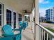 Relaxing balcony with blue chairs and ocean view at 610 S Atlantic Ave, New Smyrna Beach, FL 32169