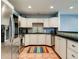 Well-equipped kitchen featuring stainless steel appliances and granite countertops at 610 S Atlantic Ave, New Smyrna Beach, FL 32169
