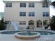 Large pool with spa and waterslide, adjacent to a multi-story house at 610 S Atlantic Ave, New Smyrna Beach, FL 32169