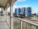 Balcony view of a coastal community featuring a modern building and ocean glimpses at 610 S Atlantic Ave, New Smyrna Beach, FL 32169