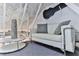 Cozy loft area with a white couch and modern decor at 830 Maralyn Ave, New Smyrna Beach, FL 32169