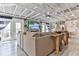 Open living room with vaulted ceiling, exposed beams, and comfy seating at 830 Maralyn Ave, New Smyrna Beach, FL 32169
