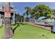 Private putting green and boat in the backyard at 830 Maralyn Ave, New Smyrna Beach, FL 32169