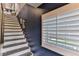 White and gray painted staircase with window view at 830 Maralyn Ave, New Smyrna Beach, FL 32169