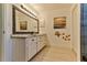 Bathroom with double vanity and granite countertop at 830 Maralyn Ave, New Smyrna Beach, FL 32169